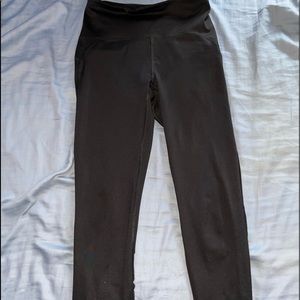 black leggings with sheer on the back bottom of the leggings.